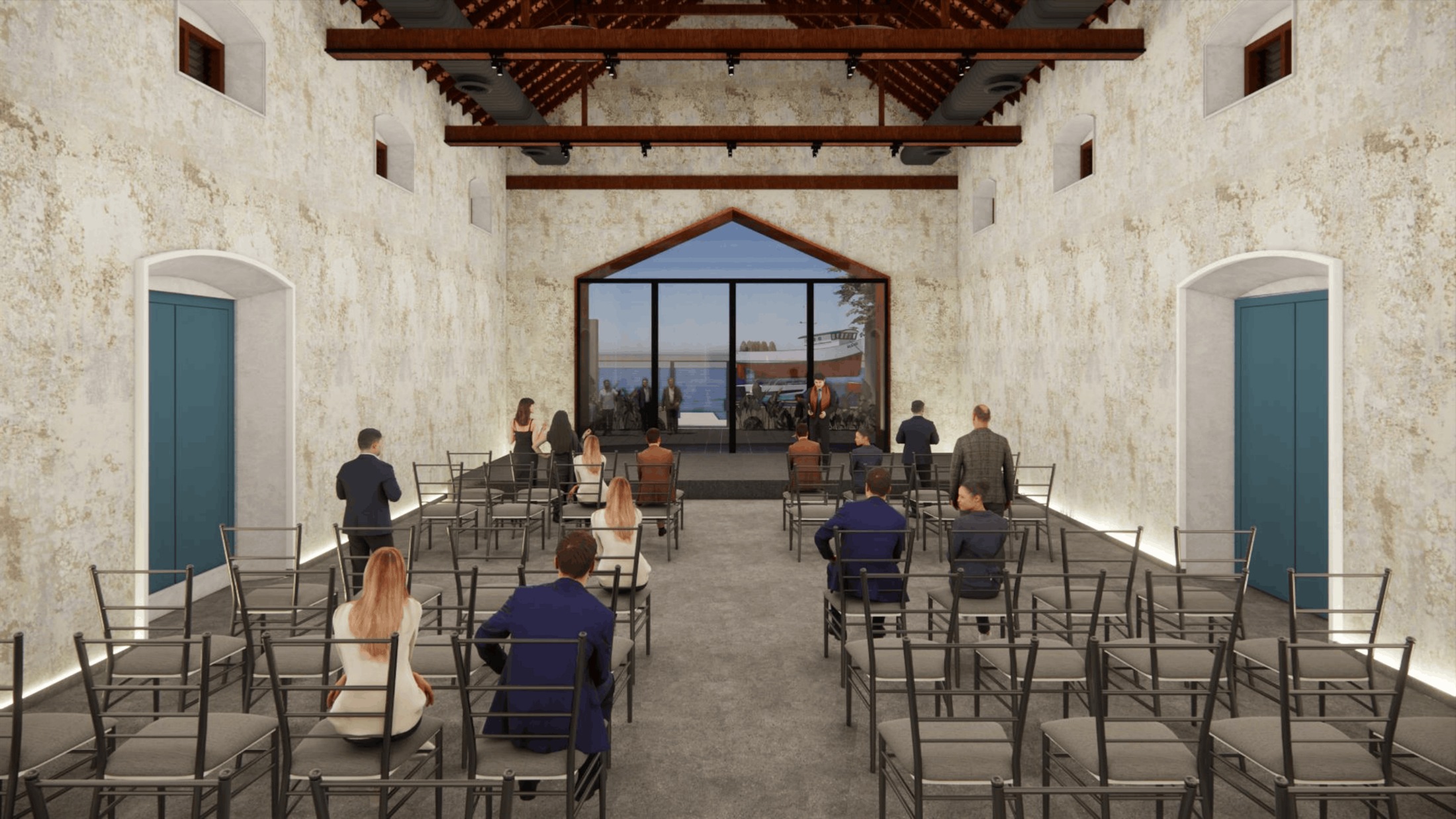 Event hall at 111 set up for a ceremony, with seating facing the glazed end wall overlooking the water