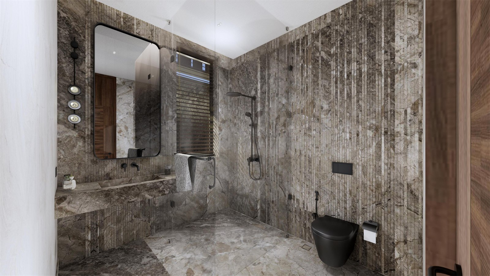 Bathroom at The Stepped Haven clad in fluted brown stone, with a carved stone basin and black fittings