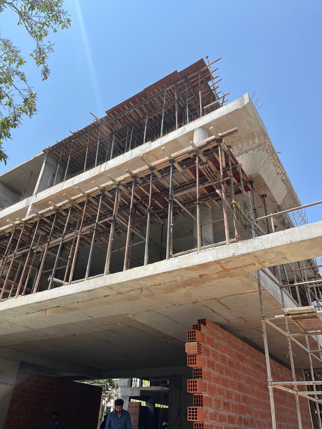 The Stepped Haven under construction, looking up at the stepped concrete slabs and formwork props