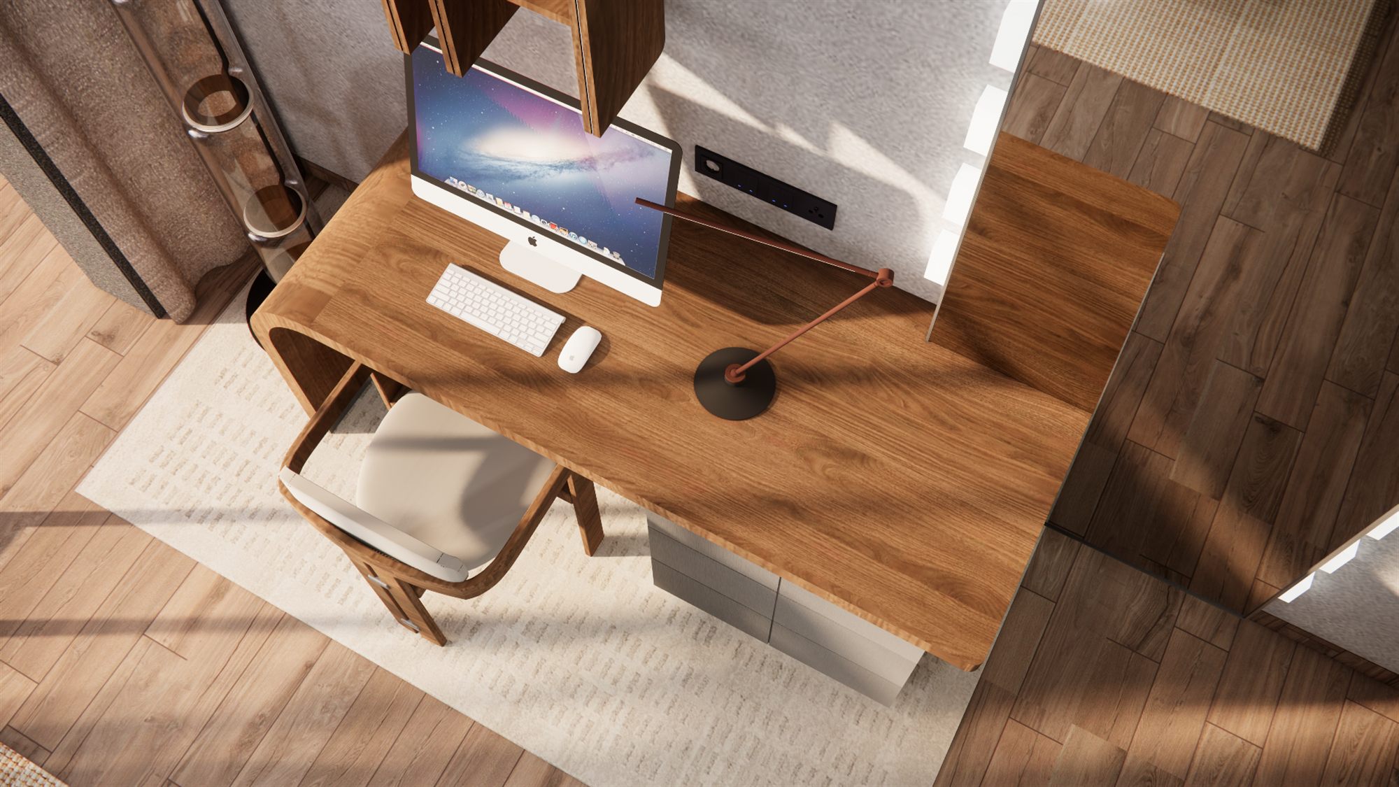 Overhead view of the desk with computer, keyboard, and angled desk lamp