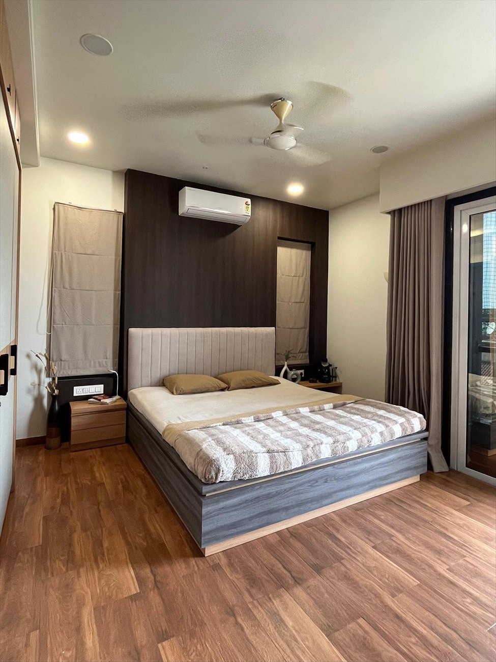 The Hideout as built: the desk nook with open shelving and the lit mirror beyond, reflecting the bed