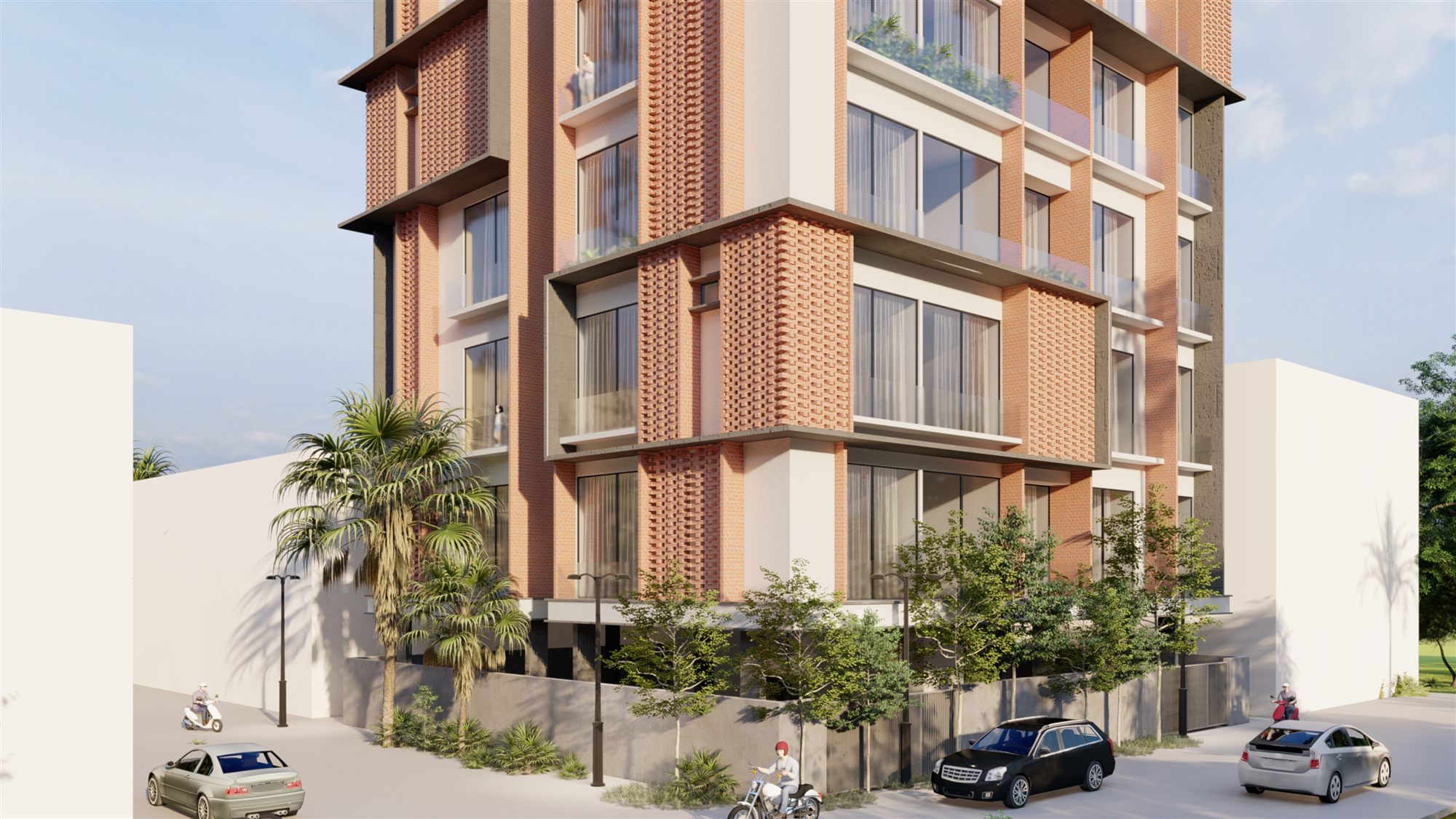 Street-level corner view of The Loom showing the brick jaali cladding and ground-floor landscaping